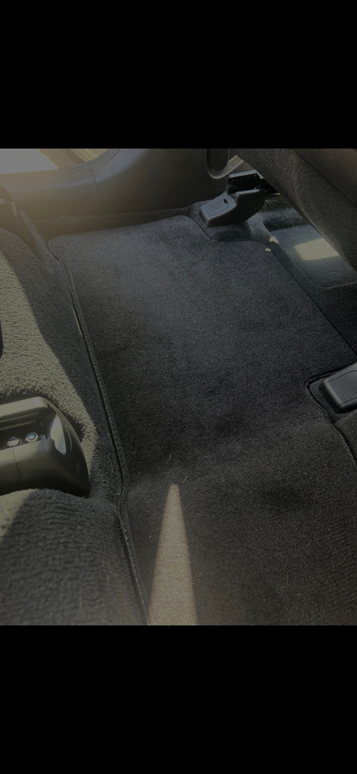 Dirty car floor mats before mobile car detailing Harford County